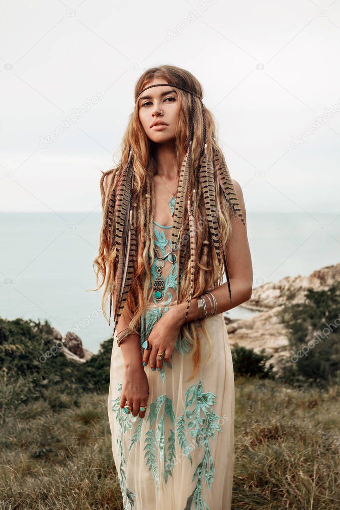 happy young caucasian woman in native clothes posing on tropical beach