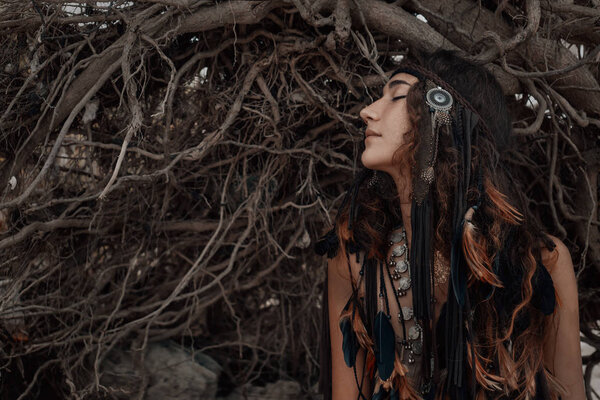boho woman close up portrait with roots background
