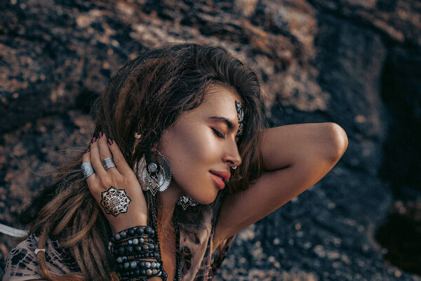 beautiful young woman with long hair with boho accessories