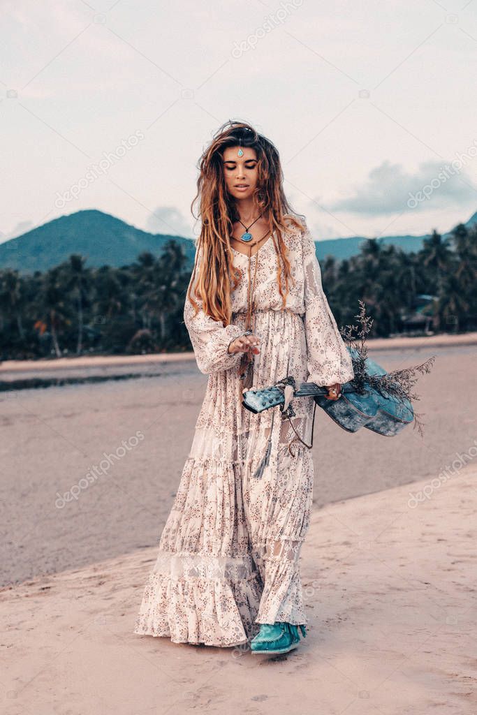 fashion boho woman at natural tropical background