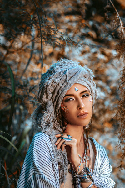 beautiful young stylish woman wearing turban outdoors portrait