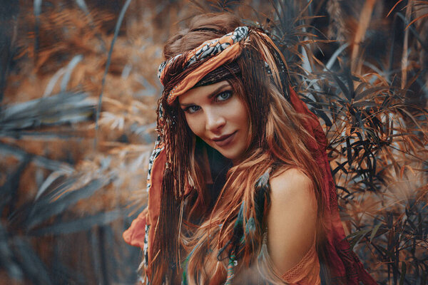 Beautiful young boho gypsy style woman outdoors portrait