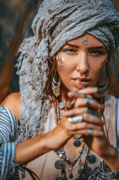 beautiful young stylish woman wearing turban outdoors portrait