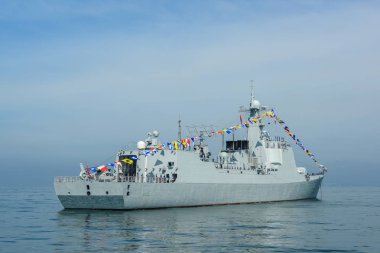 Navy warship running on sea in international fleet review drill clipart