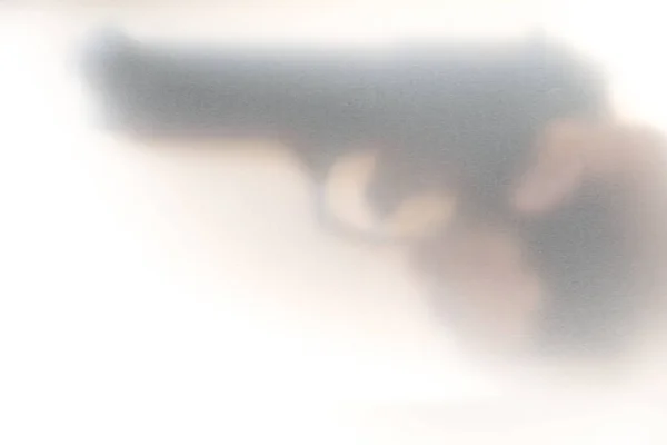 Het concept van geweld van kanonnen, Blur achtergrond. — Stockfoto