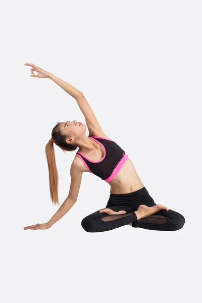 Young woman in yoga pose. — Stock Photo, Image