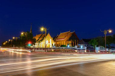 Wat Phrathat Chang Kham Worawihan in twilight scene.