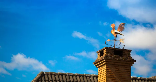 Weathercock on the chimney — Stock Photo, Image