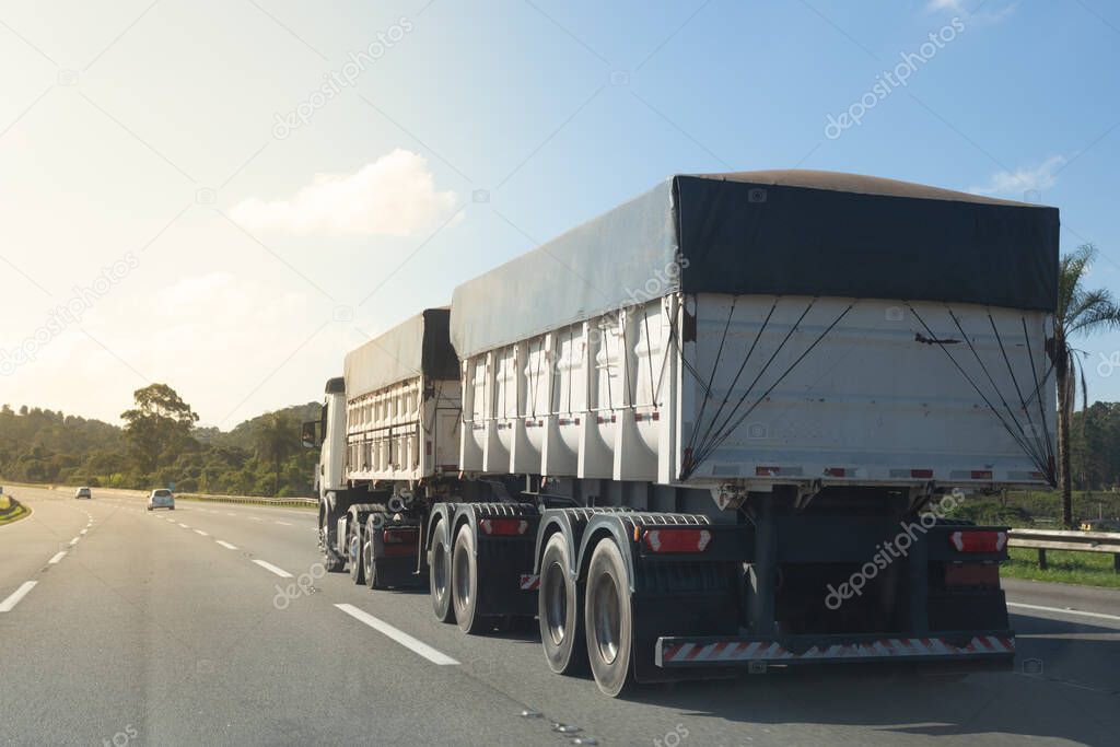 Double semi-trailer truck  at the interurban road.