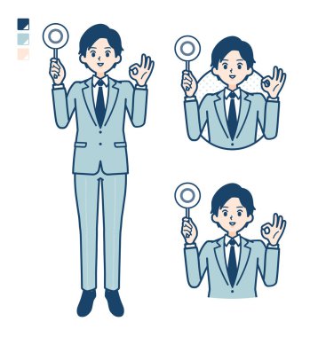 Takım elbiseli genç bir işadamı daire şeklinde bir görüntü çizdi.