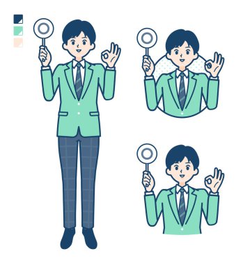 Yeşil ceketli bir öğrenci daire şeklinde bir resim çizmiş.