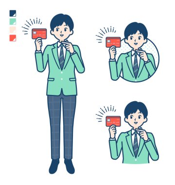 Yeşil ceketli bir öğrenci kredi kartı resimlerine bakıyor.