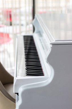 White piano with black keys clipart