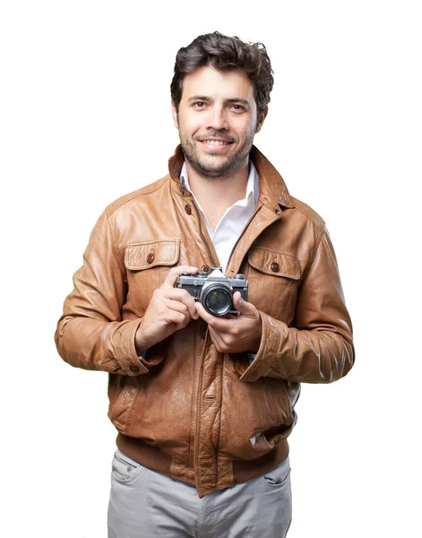 Turista com jaqueta marrom em branco — Fotografia de Stock