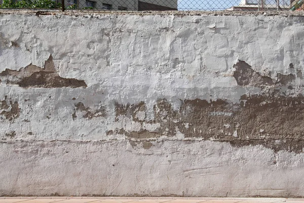 Damaged wall with peeling Stock Photo