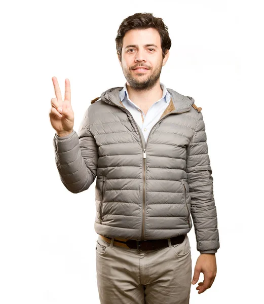 Hombre feliz haciendo un gesto de victoria — Foto de Stock