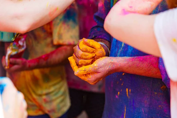 Hands with colors at Holi festival