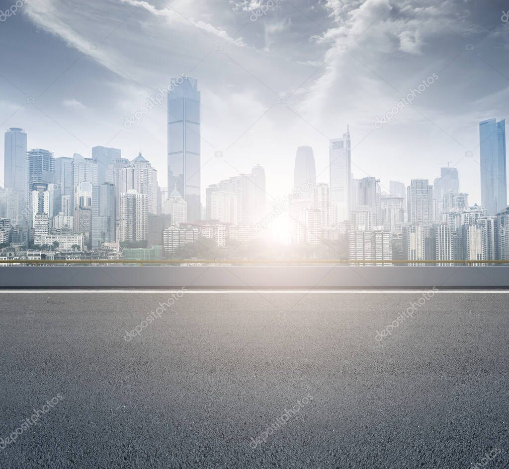 Urban skyline and road pavement