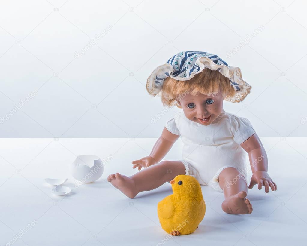 Easter concept. Surprised baby boy with chick
