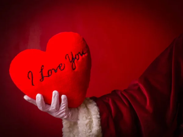 Nyilatkozat a szeretet. Kézzel, Santa Claus egy szív-szöveggel — Stock Fotó