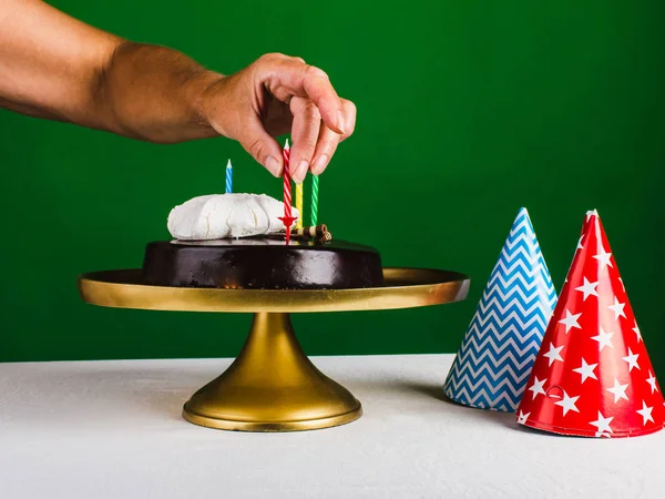 Hand of woman decorated chocolate cake. Party, congratulation co — Stock Photo, Image