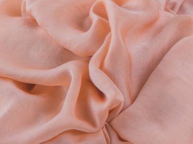 Soyut arkaplan. Pastel bej ipek kumaş, yumuşak katlar.. 