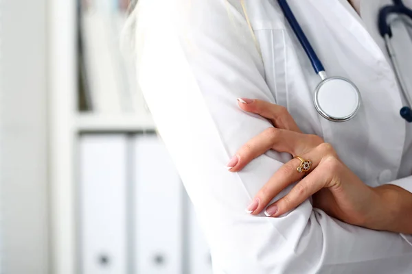 Female medicine doctor hands crossed on her chest — Stock Photo, Image