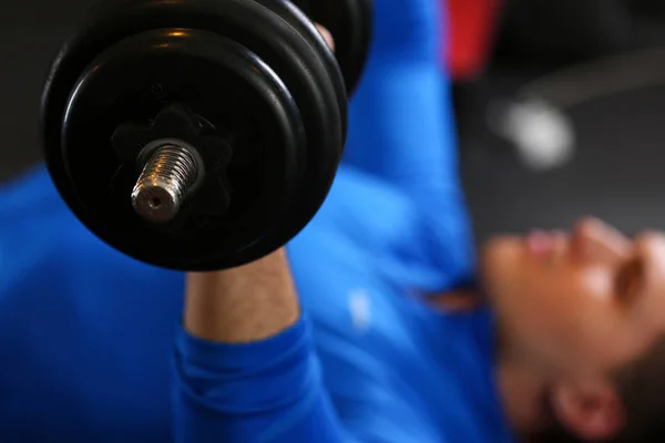 Sporty young man work out chest