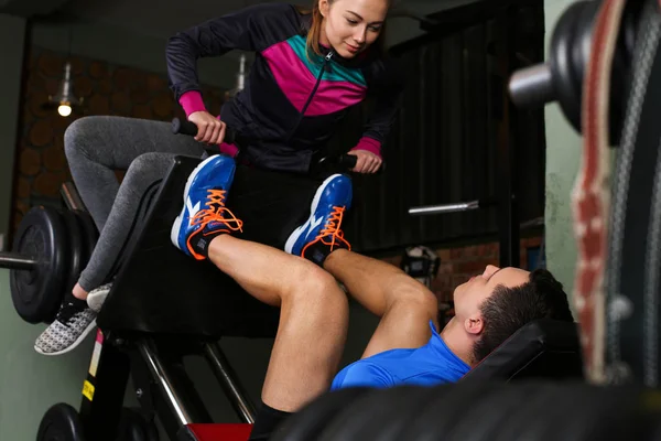 Sporty young couple work out together