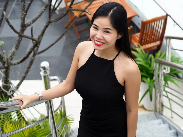 Beautiful young brunette vietnam girl wearing black dress — Stock Photo, Image