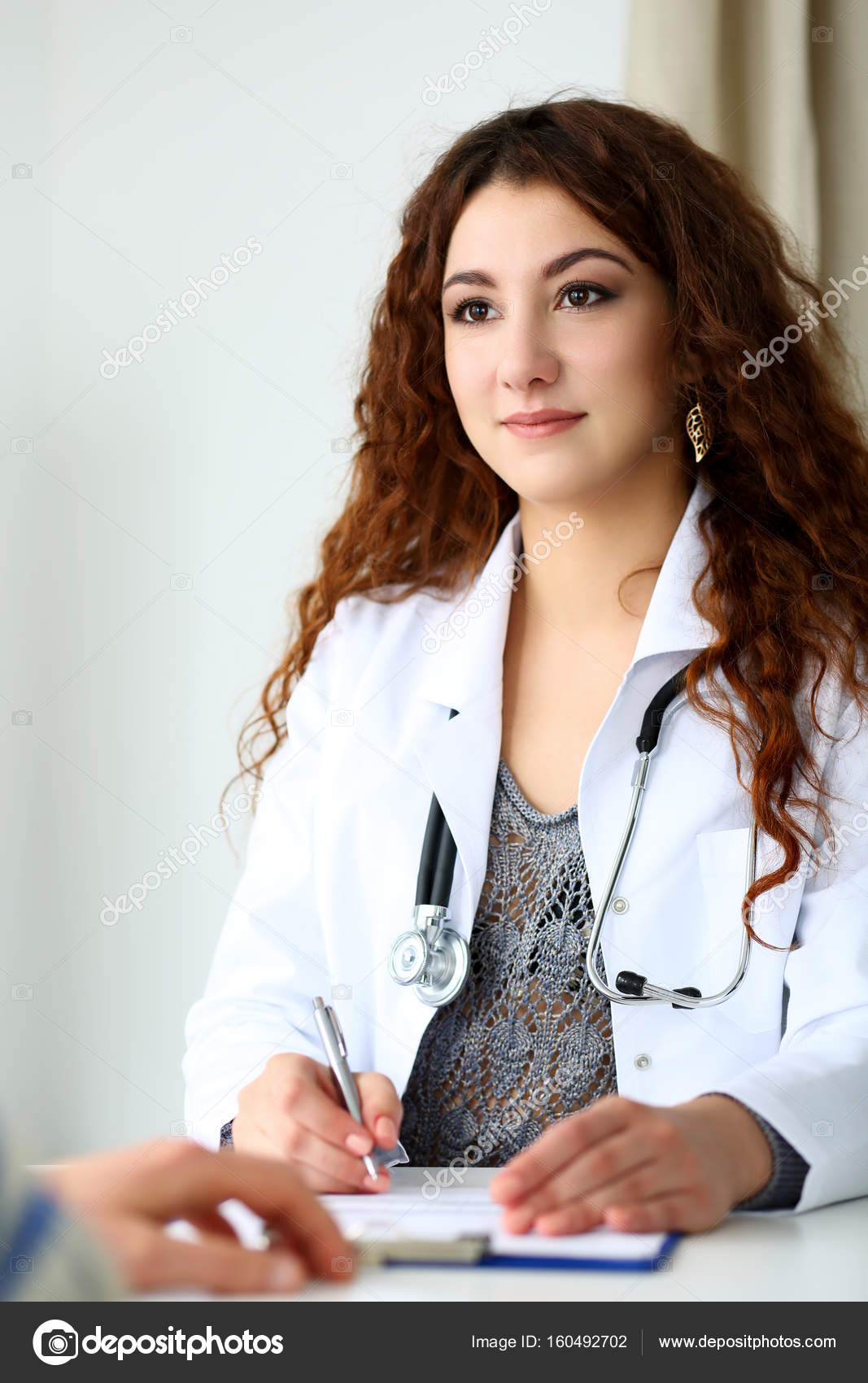 Beautiful smiling female doctor talk with patient ⬇ Stock Photo, Image by © megaflopp #160492702 Beautiful smiling female doctor talk with patient ⬇ Stock Photo, Image by © megaflopp #160492702