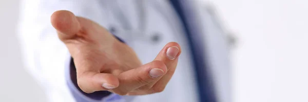 Male medicine doctor offering helping hand in office closeup — Stock Photo, Image