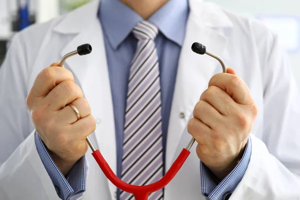 Male medicine doctor hands hold and put on stethoscope — Stock Photo, Image