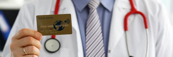 Male GP holding banking card in arm