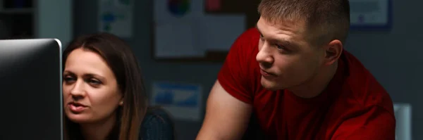 Man and girl are sitting work and looking monitor — Stock Photo, Image