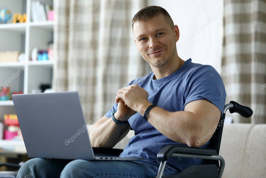 Cheerful man using computer