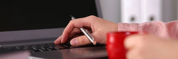 Female hands push buttons on laptop keyboard — Zdjęcie stockowe