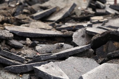 Terrible mess of road remains after some kind of catastrophe