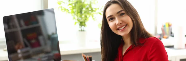 Happy office manager in red blouse — Stock Photo, Image