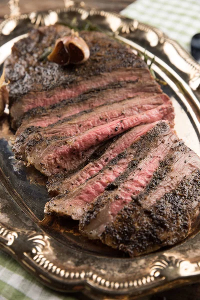 Flank steak broiled with garlic