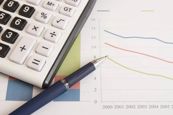 Calculator on economy graphic — Stock Photo, Image