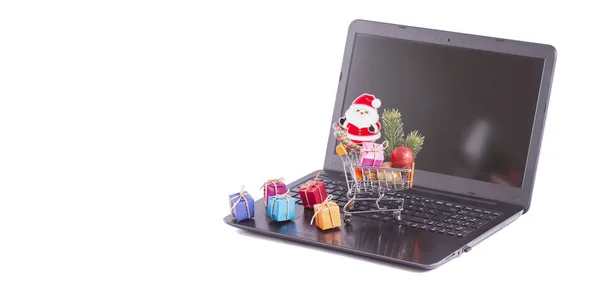 Gift packs and christmas decorations on computer — Stock Photo, Image