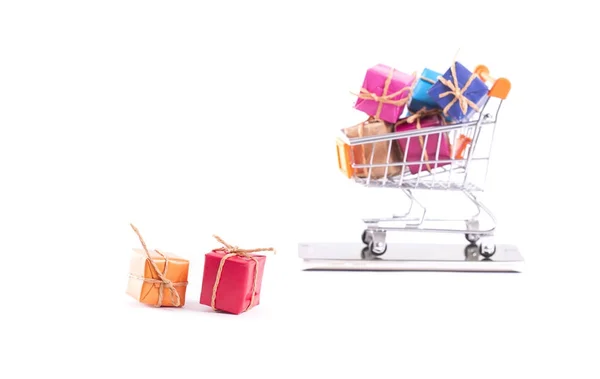 Colorful gift box and trolley — Stock Photo, Image