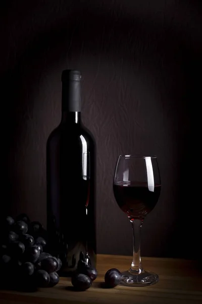 glass and bottle wine with grape