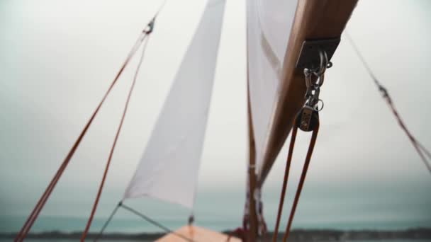 Sail on wooden sailboat with ropes and wooden blocks. — Stock Video