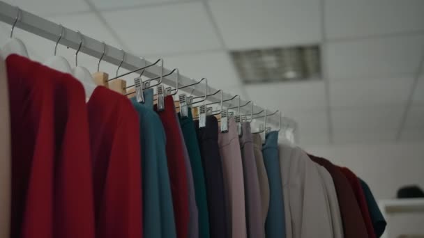 Clothes rail in modern shop. — Stock Video