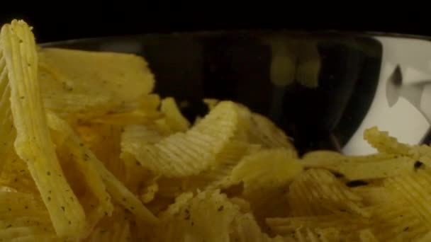 Ribbed chips falling into bowl. — 비디오