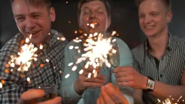 Sparkles. Holiday Celebrating by Young Men — Stock Video