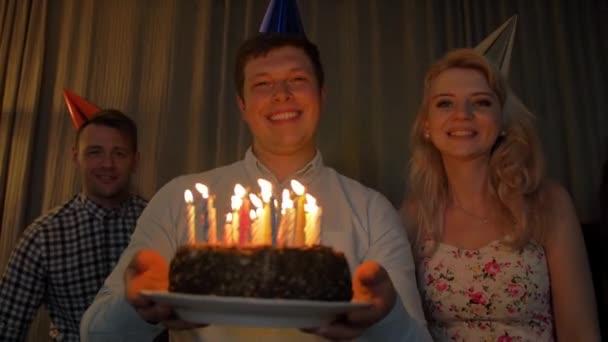 Happy guy with friends bringing birthday cake to You. — Stockvideo