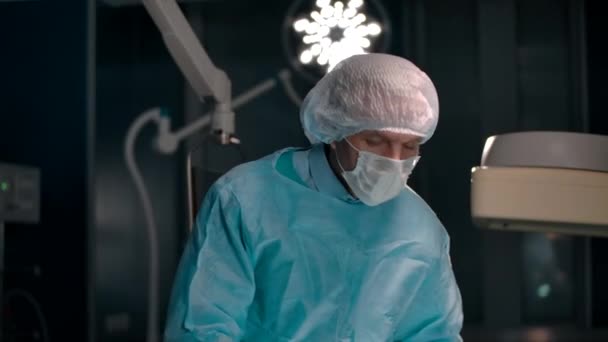 Portrait of a surgeon removing a mask after a successful operation — Stock Video